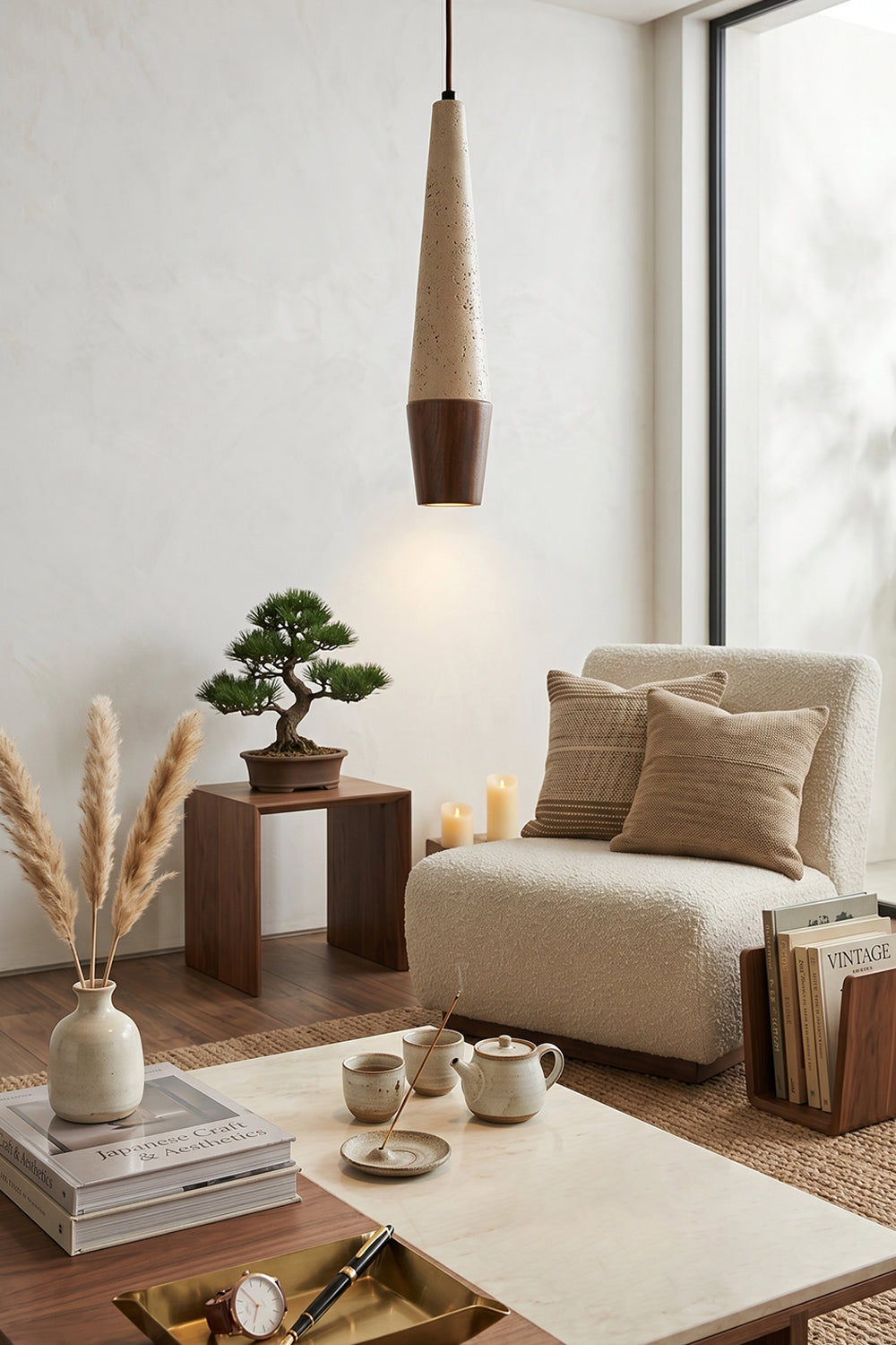 Conical Tiber Travertine Pendant Light | Travertine, Wood | Minimalist lounge area with bonsai and coffee table | Samu Lamp