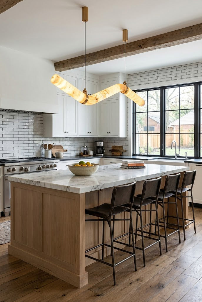 Contemporary alabaster tube light over a kitchen island | Alabaster, Brass | Modern kitchen interior with white cabinetry | Samu Lamp