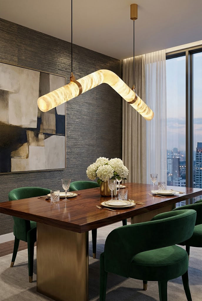 Undulating alabaster tube chandelier over green chairs | Alabaster, Brass | Modern dining room with dark wood table | Samu Lamp