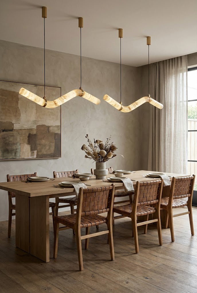 Contemporary alabaster pendant over a set dining table | Alabaster, Brass | Interior scene with neutral walls and classic decor | Samu Lamp