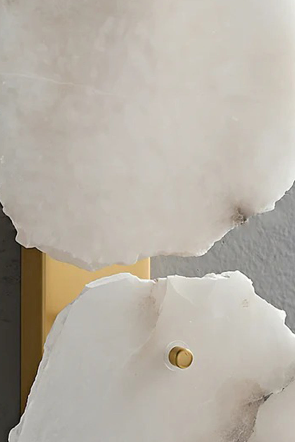 Close-up of the Corin Alabaster Wall Sconce highlighting its natural alabaster and brass-finished metal details.