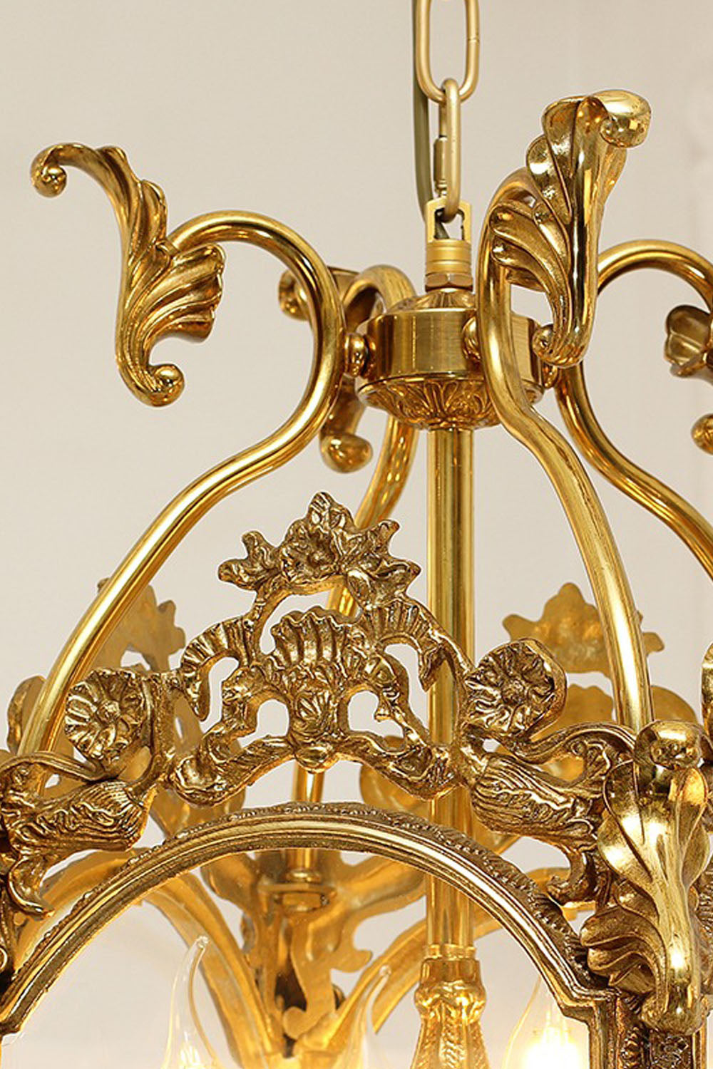 Corwin Glazed Brass Pendant Light intricate detailing with ornate gold finish and elegant design.