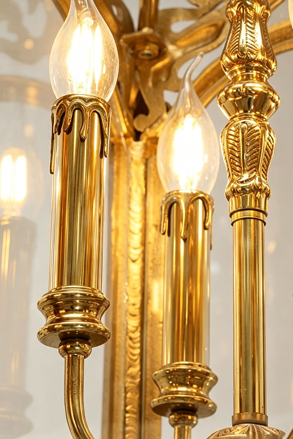 Corwin Glazed Brass Pendant Light with elegant candle-style bulbs and a polished finish