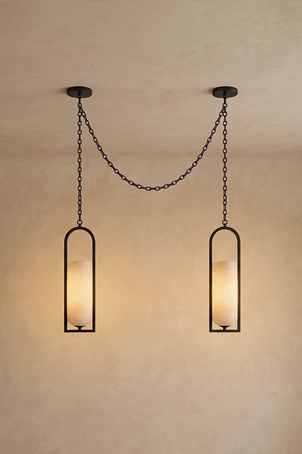 Cressida Alabaster Melange Chain Chandelier hanging from the ceiling in an upscale modern interior.