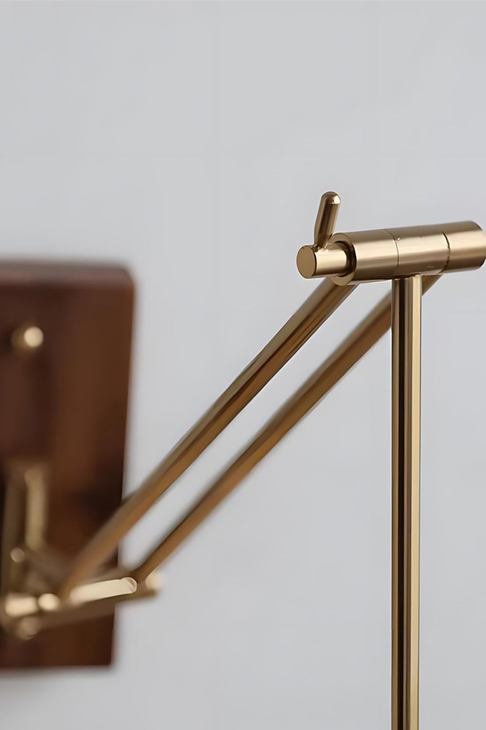 Cynthia Butterfly Articulated Wall Lamp | Stained Glass, Metal, Wood | Close-up focus on the multi-jointed mechanical brass articulated swing arm mechanism | Detail shot | Samu Lamp