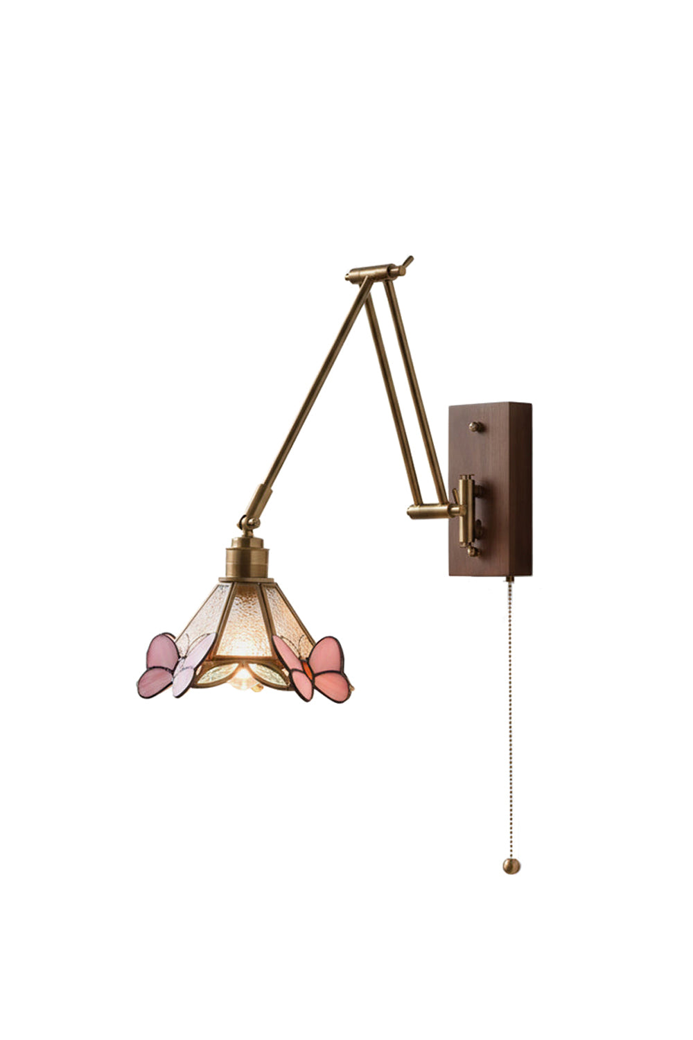 Cynthia Butterfly Articulated Wall Lamp | Stained Glass, Metal, Wood | Conical Tiffany-style stained glass wall sconce featuring pink butterflies, a multi-jointed articulated gold brass swing arm, and a rectangular wood backplate with a pull chain | Isolated lit product shot on white background | Samu Lamp