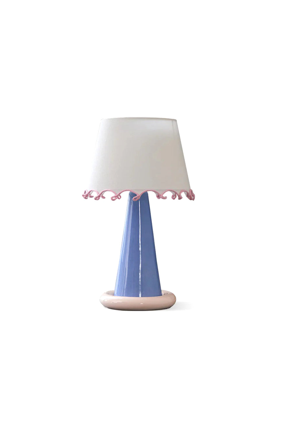 Dolce Ribbon Ceramic Table Lamp | Ceramic, Fabric | Isolated view of a whimsical contemporary table lamp featuring a tapered periwinkle blue ceramic body, pink doughnut base ring, and white fabric shade with a wavy pink ribbon trim | White background | Samu Lamp