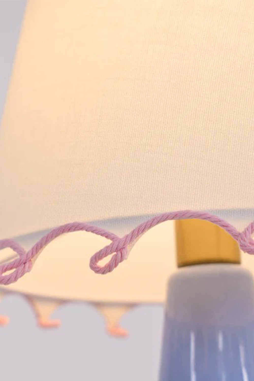 Dolce Ribbon Ceramic Table Lamp | Ceramic, Fabric | Macro close-up focus on the lamp shade edge highlighting the intricate pink embroidered wavy ribbon loop trim | Detail shot | Samu Lamp