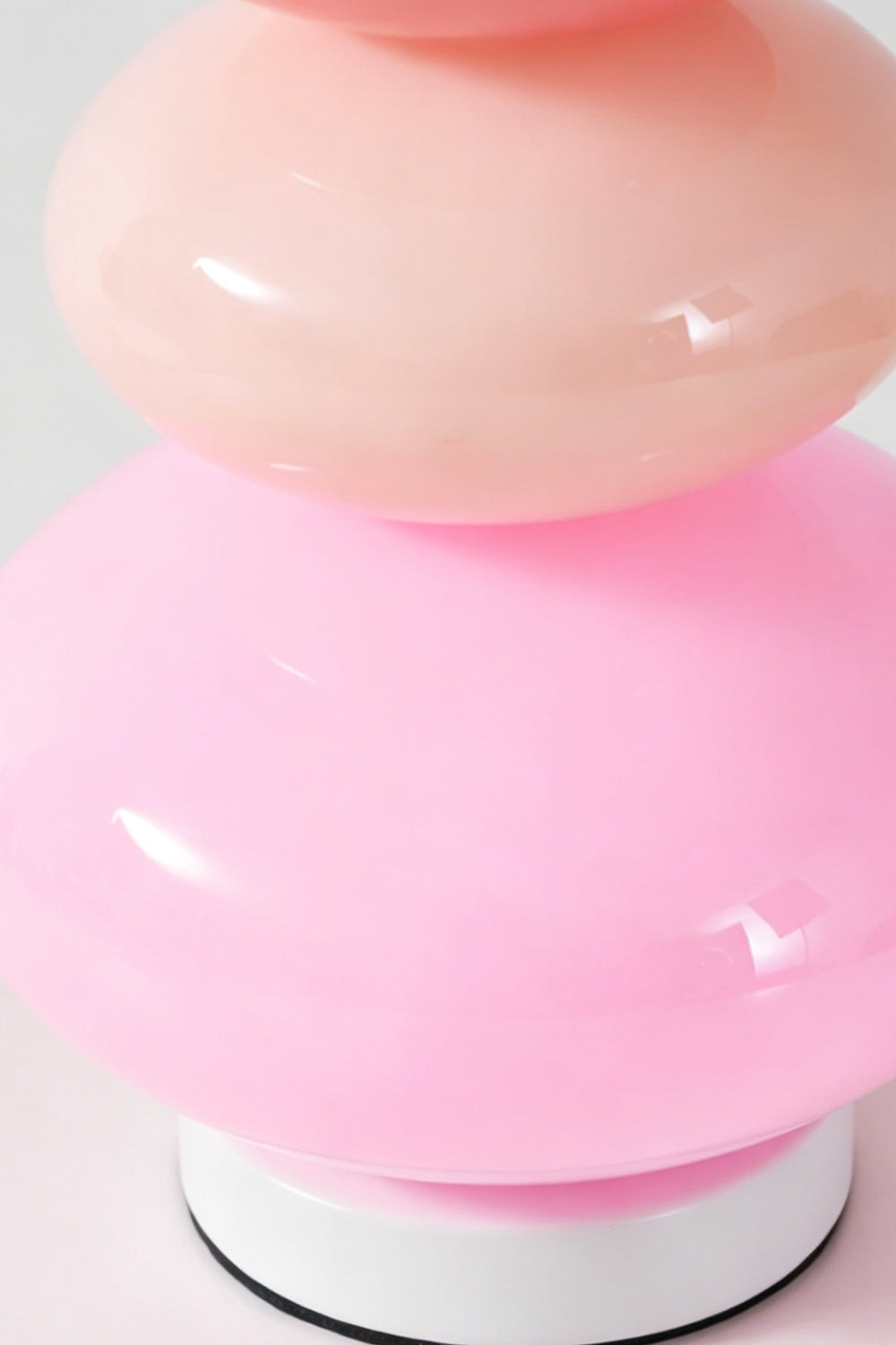 Dolce Stacked Pastel Glass Table Lamp | Glass, Metal | Close-up macro focus on the glossy candy pink and soft magenta glass tiers and white base ring | Detail shot | Samu Lamp