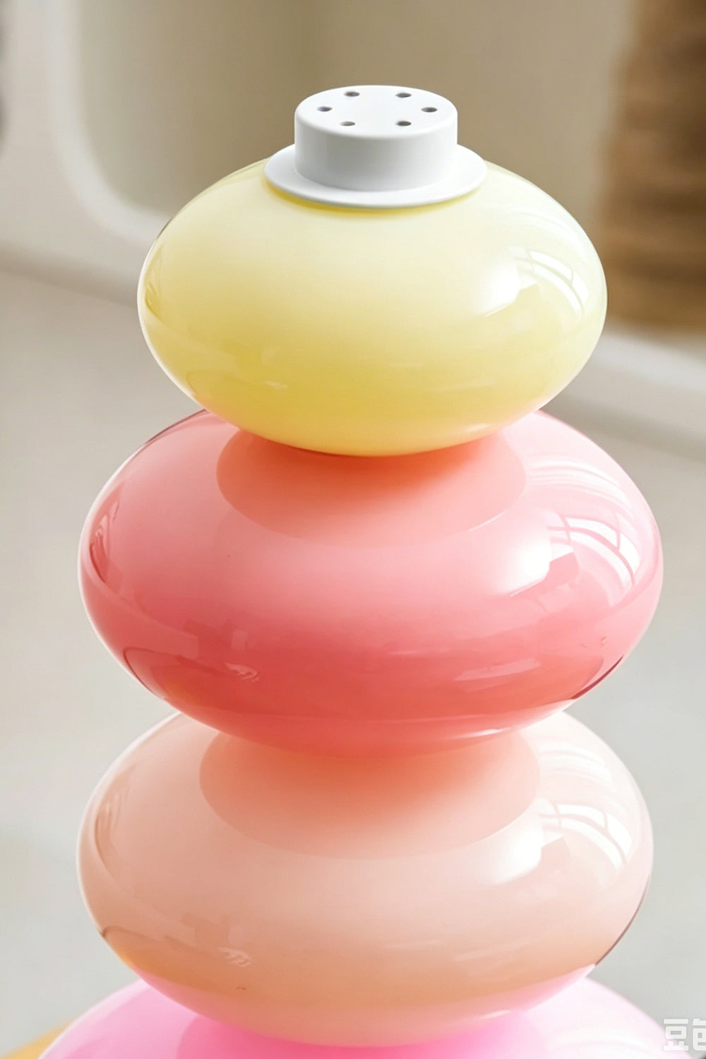 Dolce Stacked Pastel Glass Table Lamp | Glass, Metal | Detailed close-up showing the translucent pastel yellow and pink rounded glass segments | Detail shot | Samu Lamp