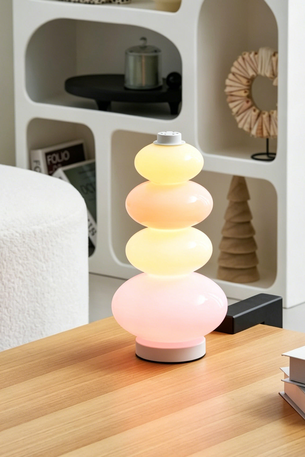 Dolce Stacked Pastel Glass Table Lamp | Glass, Metal | Styled on a smooth wooden coffee table in a contemporary lounge area with white bouclé furniture | Samu Lamp