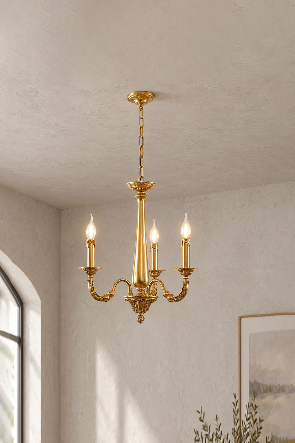 Dorvanne Brass Scroll Arm Candle Chandelier | Solid Brass | 6-light variant glowing in a plain room | Samu Lamp