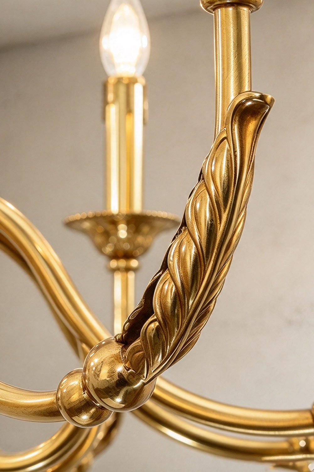 Dorvanne Brass Scroll Arm Candle Chandelier | Solid Brass | Close-up of ornate scroll arm and candle socket | Samu Lamp