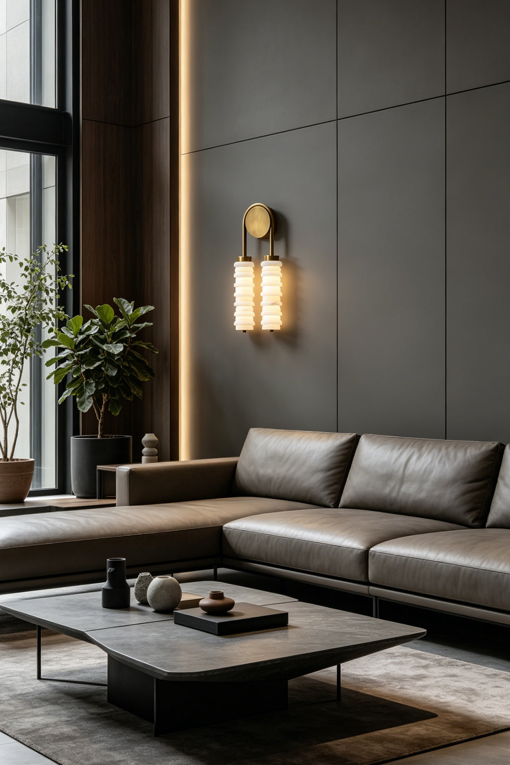 Dual Strata Alabaster Wall Lamp | Metal, Alabaster | Lit lamp in a contemporary dark living room corner, near a leather sofa and plants | Samu Lamp