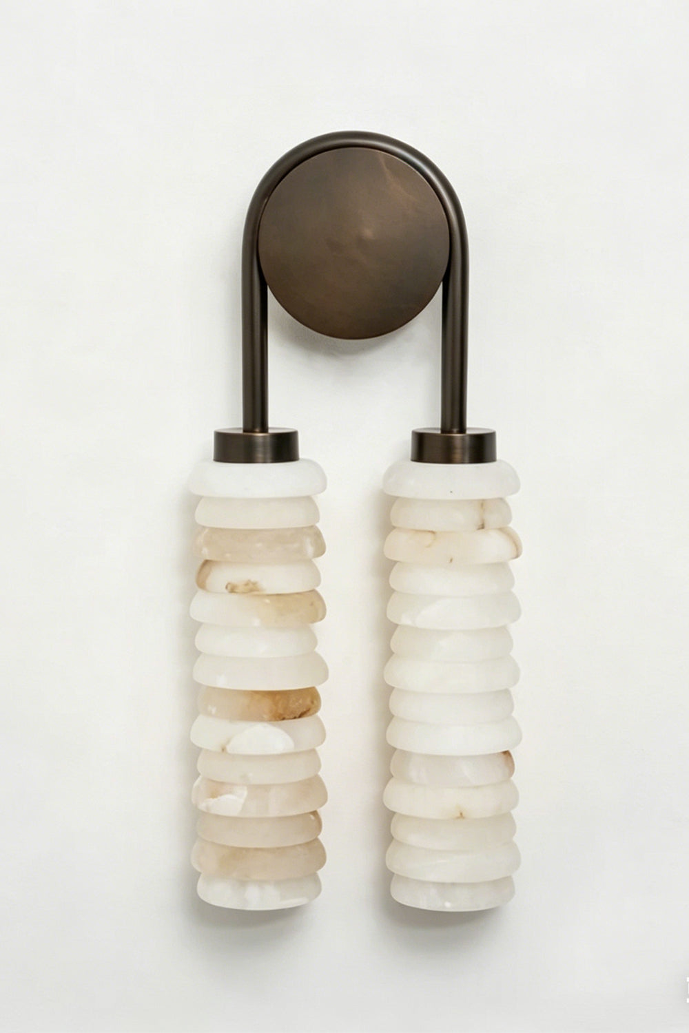 Dual Strata Alabaster Wall Lamp | Metal, Alabaster | Lit perspective view against a dark textured background, highlighting the glowing stone texture | Samu Lamp