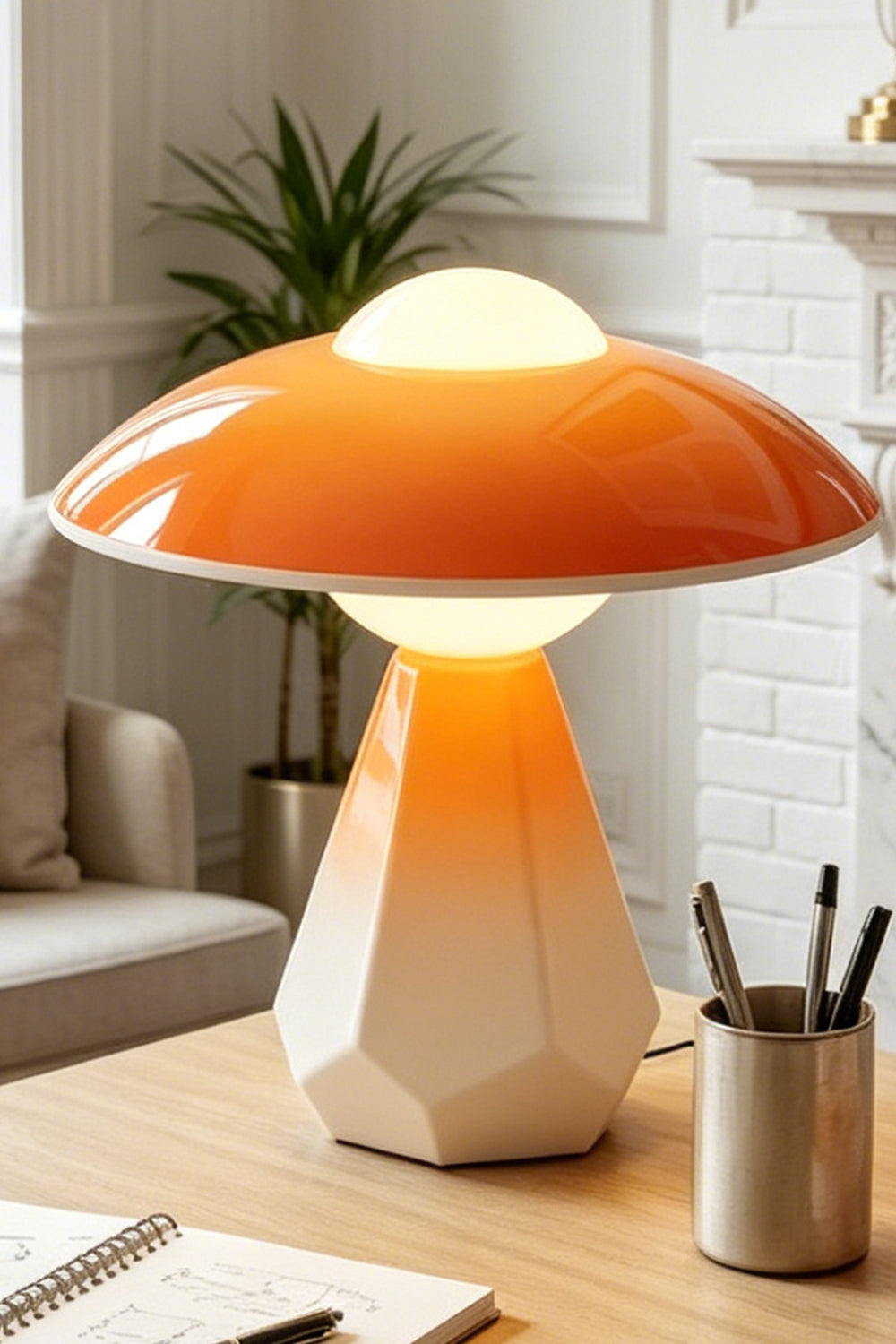 Duskora Retro Mushroom Table Lamp | Ceramic, Glass | Close-up focus showcasing the unique architectural faceted geometric base and bright orange mushroom cap on a desk | Detail shot | Samu Lamp