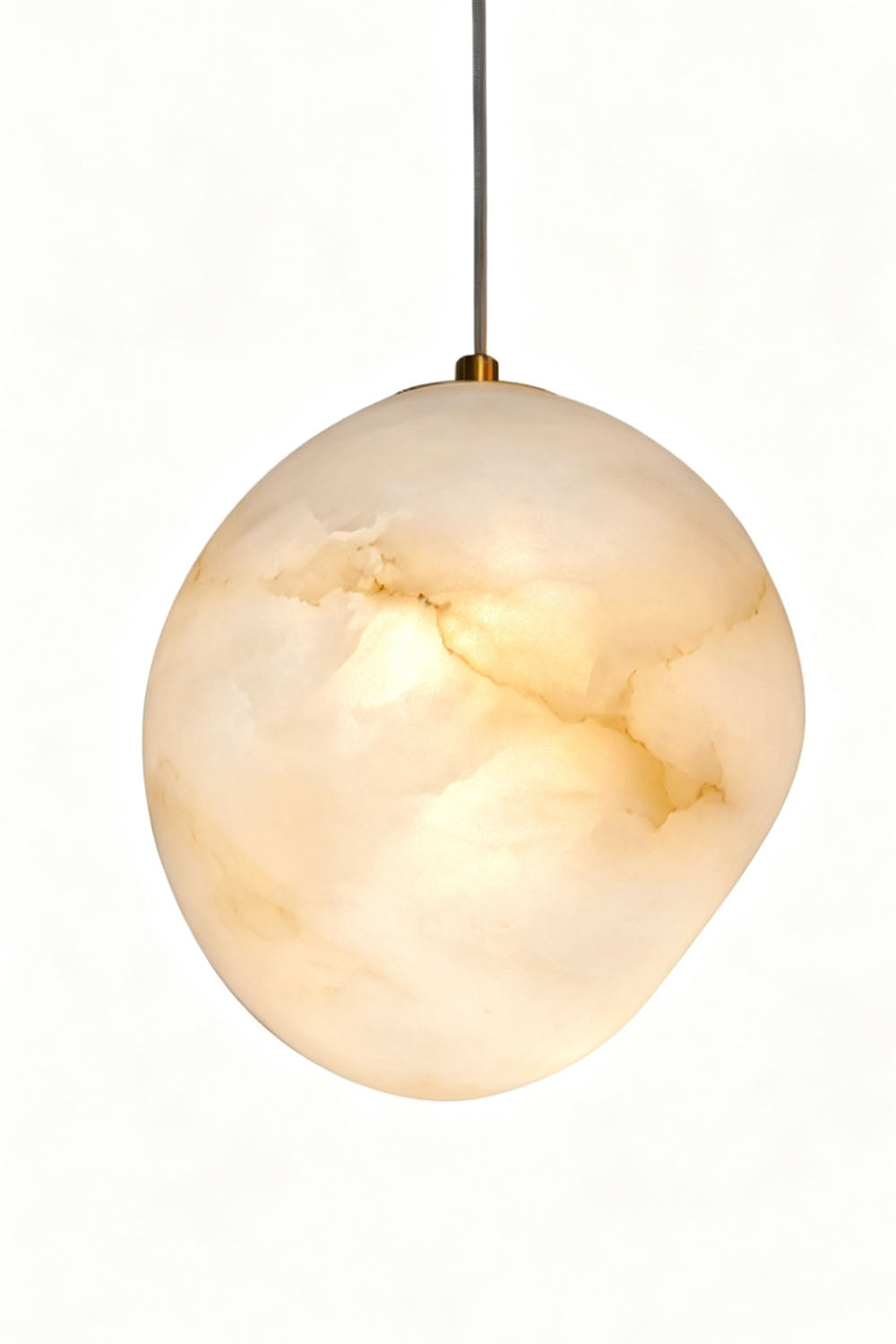 Elodie Teardrop Alabaster Pendant Light showcasing a hand-chiseled organic shape and unique design, perfect for elevating home decor.