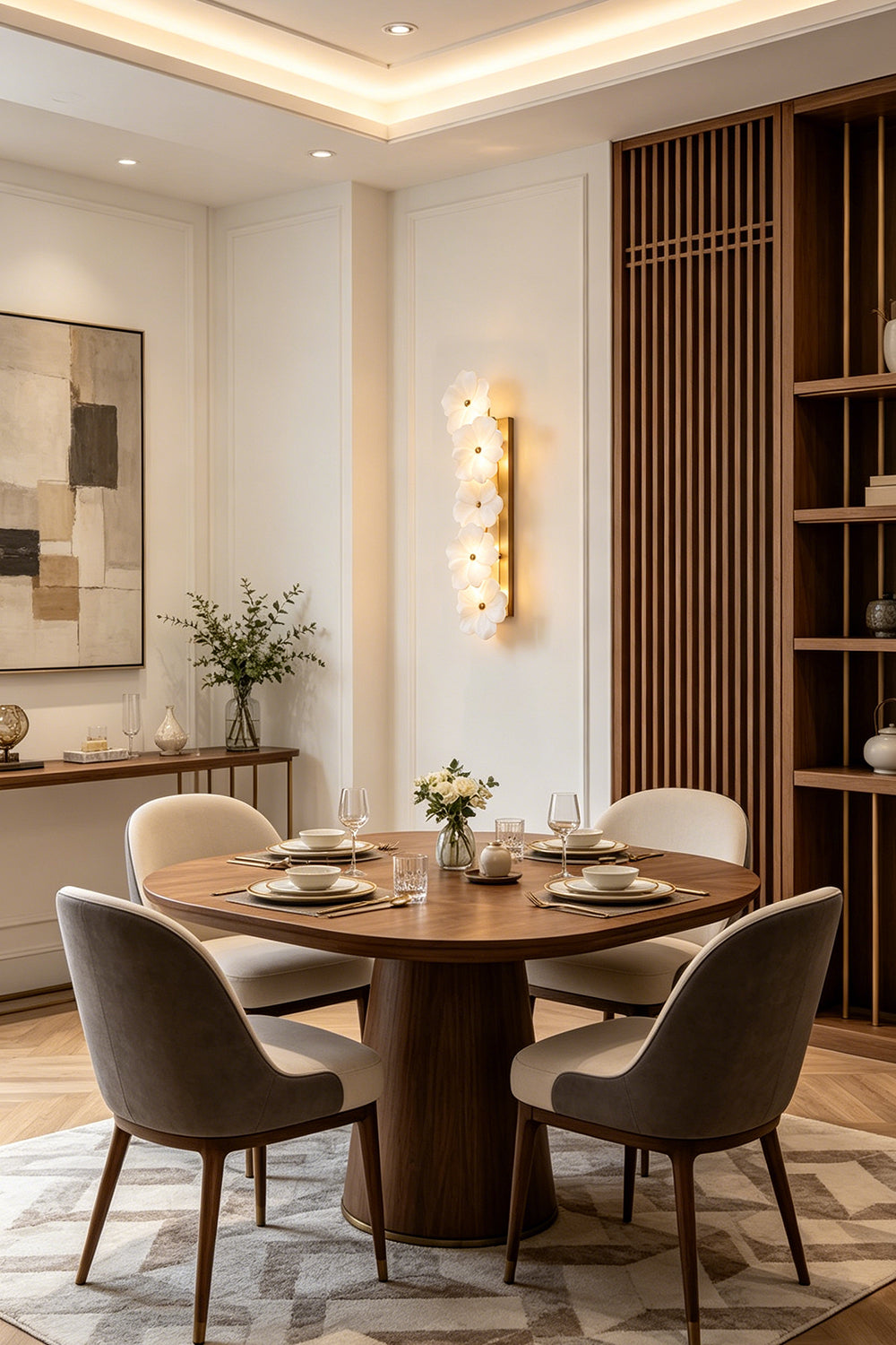 Elowen Alabaster Blossom Wall Light | Dining Room Decor | Radiating a soft ambient glow on a white wall in a refined dining room setup with a round wooden table and chairs | Samu Lamp