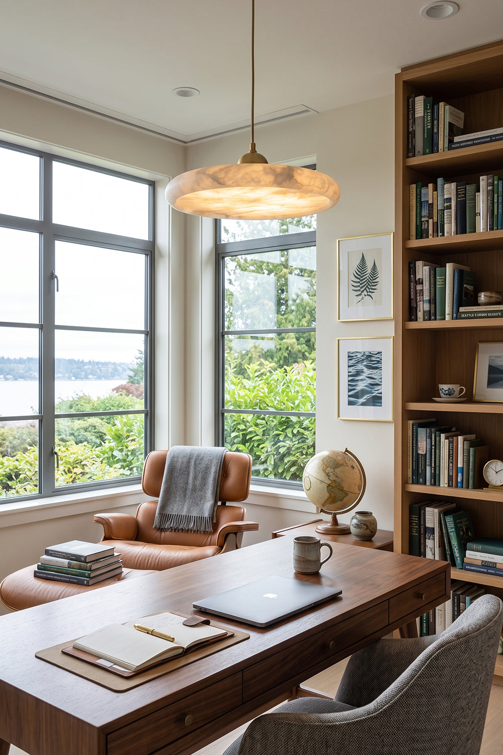 Elowen Alabaster Disc Pendant Light | Natural Alabaster and Brass | Styled in a contemporary home office library workspace over a dark wood desk and leather chair | Samu Lamp