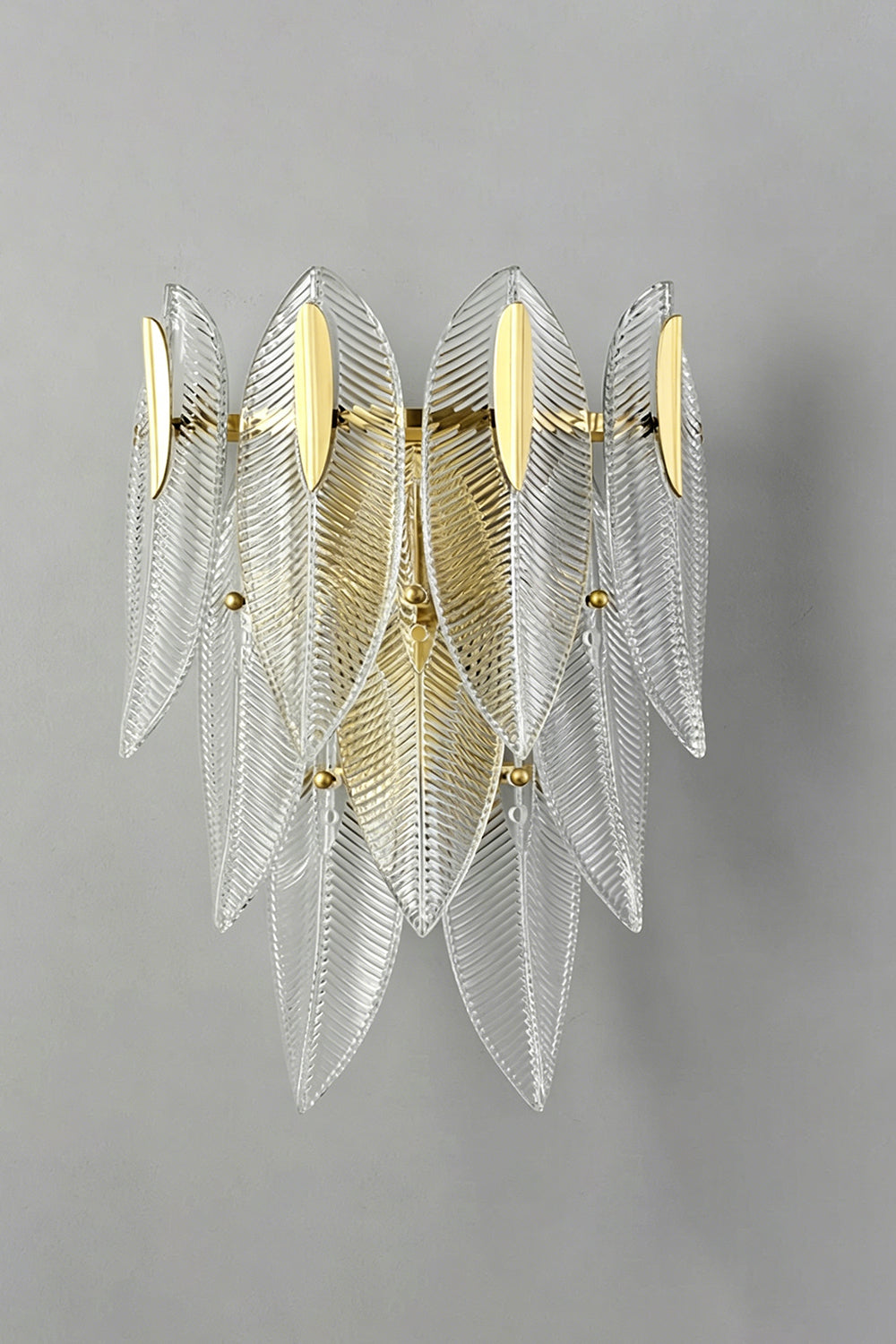 Elowen Cascading Glass Wall Lamp | Glass, Metal | Unlit front studio view of the cascading textured clear glass sconce showcased against a plain grey wall background | Samu Lamp