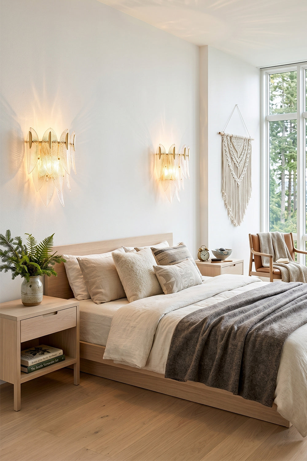 Elowen Cascading Glass Wall Lamp | Glass, Metal | A pair of cascading glass wall sconces symmetrically lighting an elegant contemporary bedroom with neutral linens | Samu Lamp