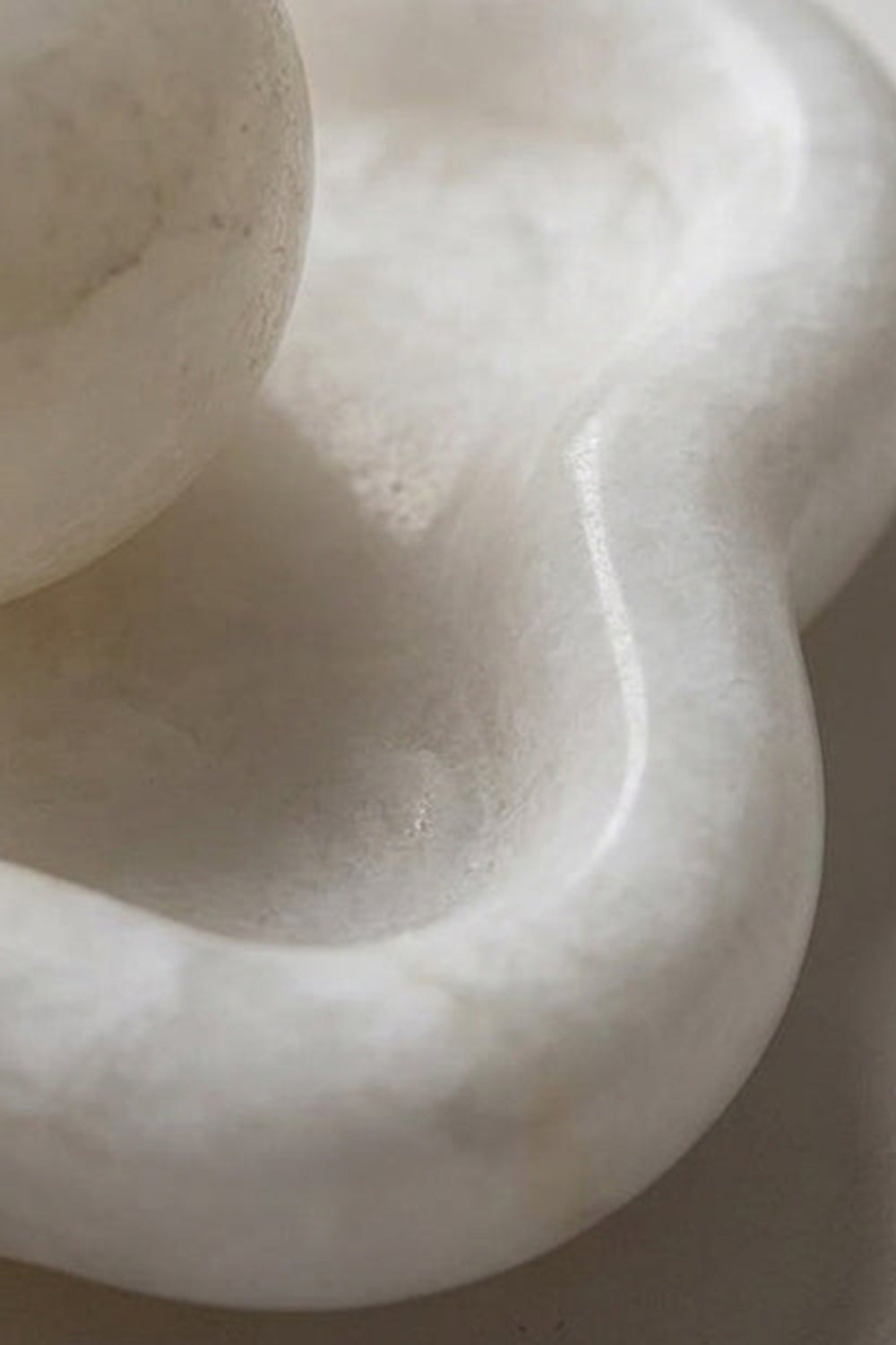 Elowen Petal Alabaster Wall Sconce | Natural Alabaster | Detailed macro profile view highlighting the curved organic edges and smooth texture of the stone petals | Samu Lamp