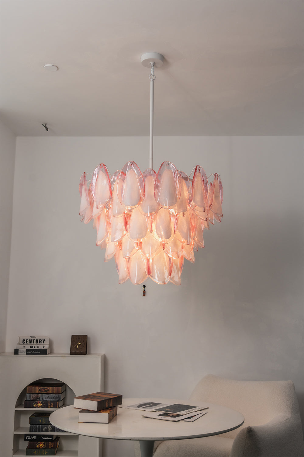 Elysian Bloom Rose Glass Chandelier | Metal, Glass | Positioned over a small round table and armchair in a minimalist room corner | Samu Lamp