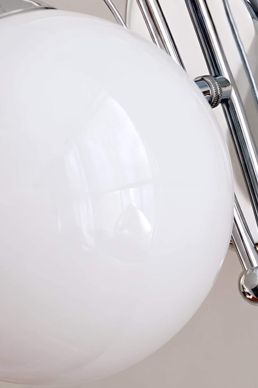 White frosted glass globe detail | Glass, Metal | Close-up showing chrome arm and base | Samu Lamp