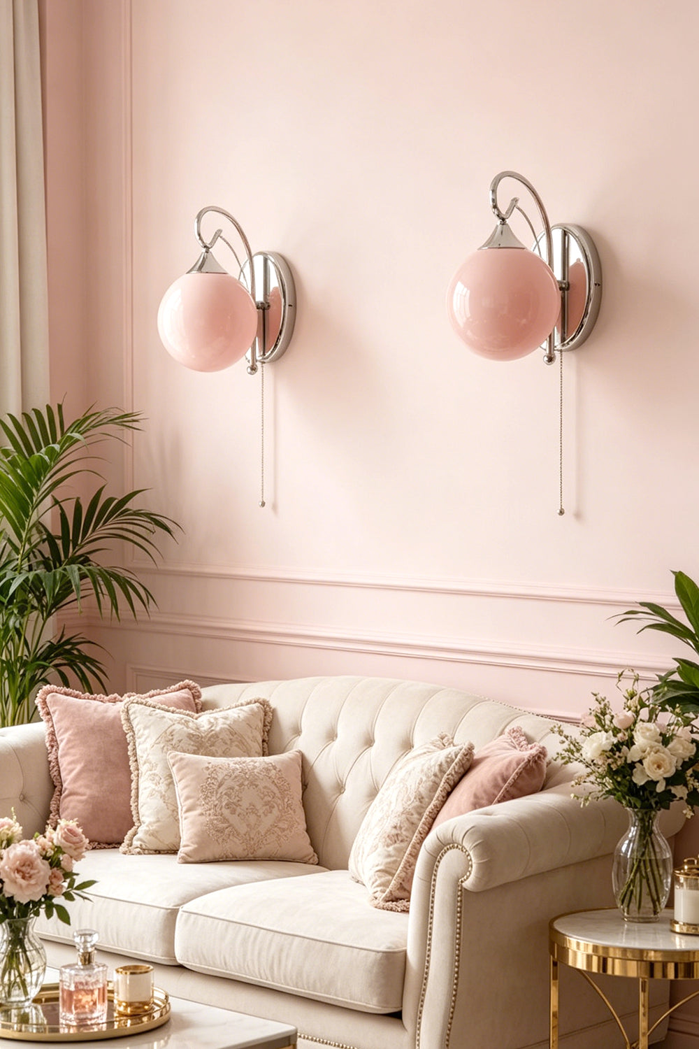 Two pink glass wall lamps | Metal, Glass | Mounted on pink wall above tufted sofa | Samu Lamp