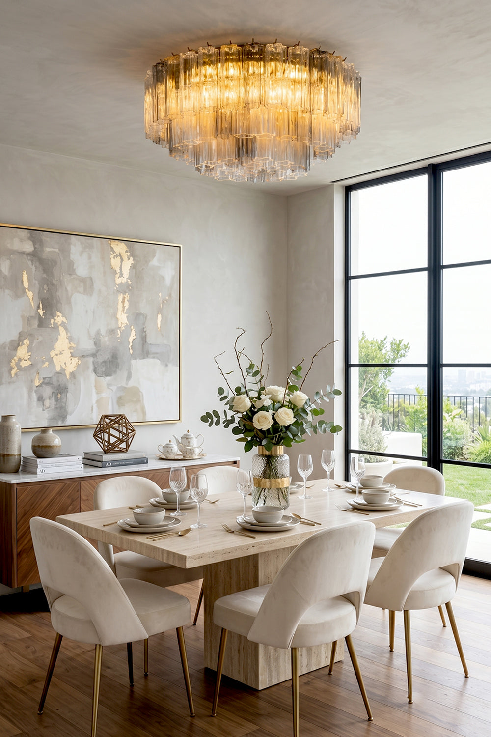 Elysian Tiered Fluted Ceiling Light | Glass, Metal | Casting a brilliant golden glow over an elegant dining room arrangement with a light-colored table and minimalist chairs | Samu Lamp