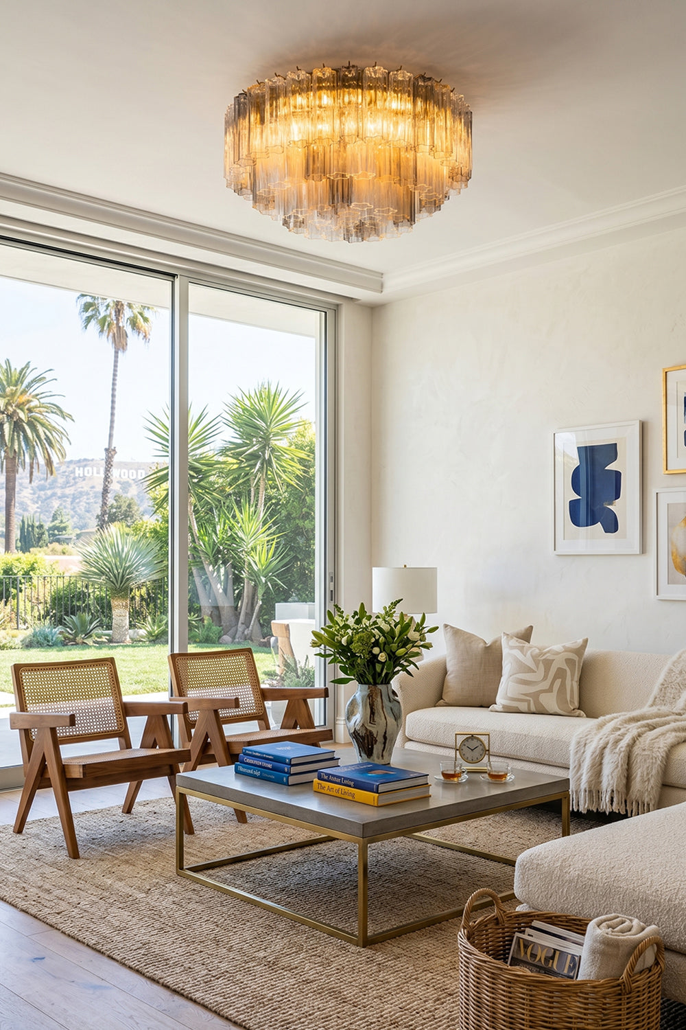 Elysian Tiered Fluted Ceiling Light | Glass, Metal | Providing a warm ambient halo in a bright modern living room with cream sofas and large sliding glass patio doors | Samu Lamp