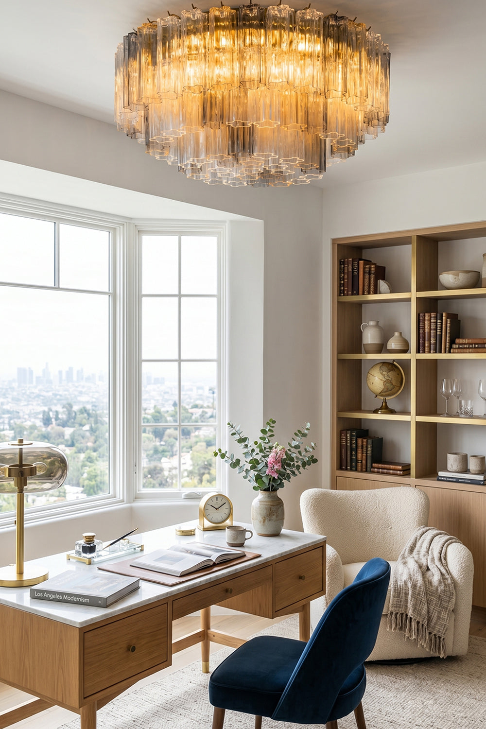Elysian Tiered Fluted Ceiling Light | Glass, Metal | Illuminating a minimalist contemporary study area over a wooden writing desk paired with a dark blue velvet chair | Samu Lamp