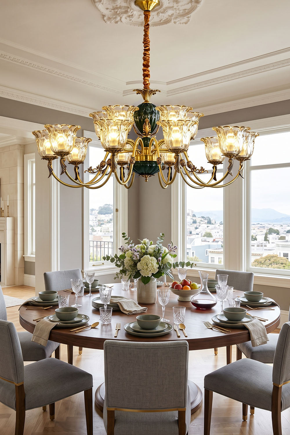 Emeric Green Porcelain and Brass Chandelier illuminating an elegant dining room with a round table.