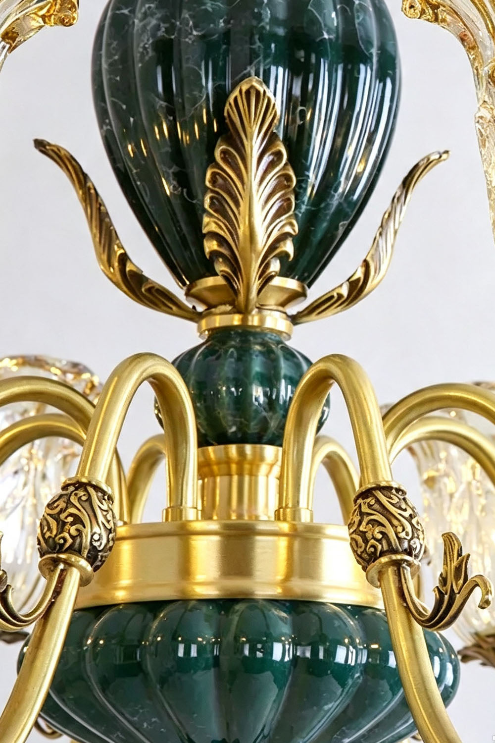 Emeric Green Porcelain and Brass Chandelier close-up showcasing intricate design and details in green and gold.