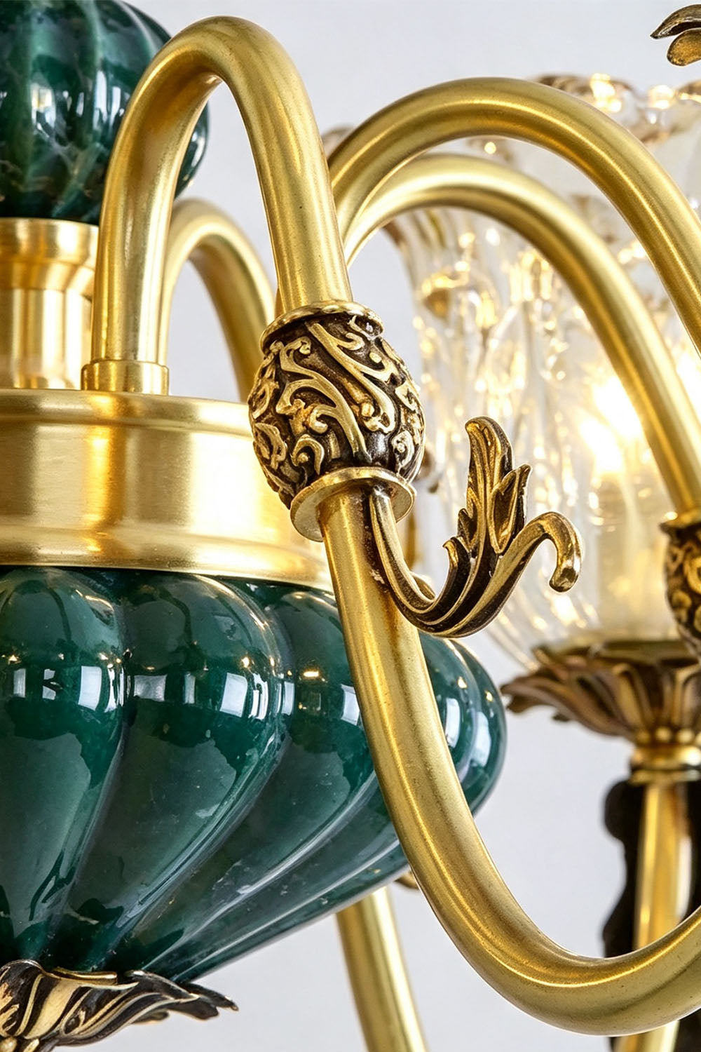 Emeric Green Porcelain and Brass Chandelier close-up, showcasing brass details and elegant glass accents.