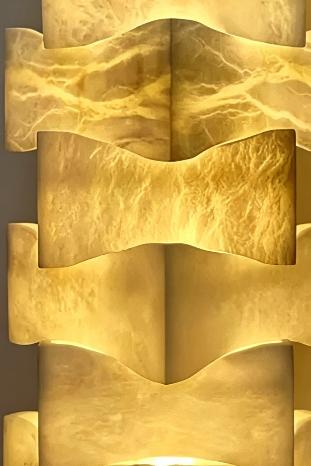 Ethereal Monolith lamp detail | Extreme close-up of stacked blocks | Intricate marble-like veining highlighted by warm internal light | Alabaster texture | Product detail | Samu Lamp