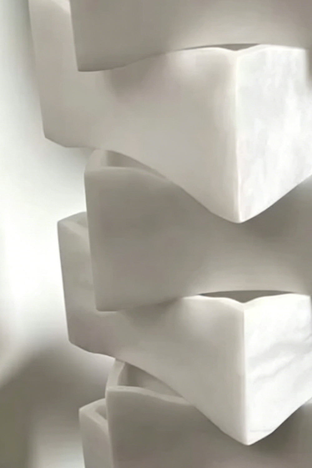 Ethereal Monolith lamp structure | Detailed close-up of interlinking block joints | Complex, puzzle-like stacked assembly | Alabaster stone finish | Product detail | Samu Lamp
