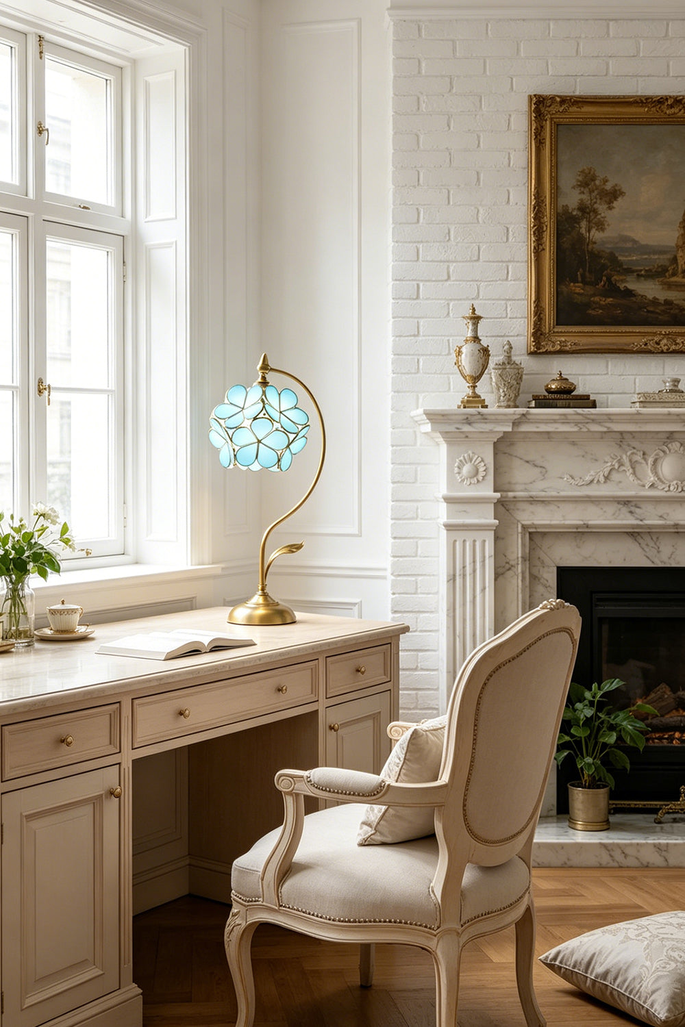 Evanthe Blossom Stained Glass Table Lamp | Stained Glass, Metal | Positioned as a charming desk light on a vintage white wooden writing table paired with a classical French upholstered armchair | Samu Lamp