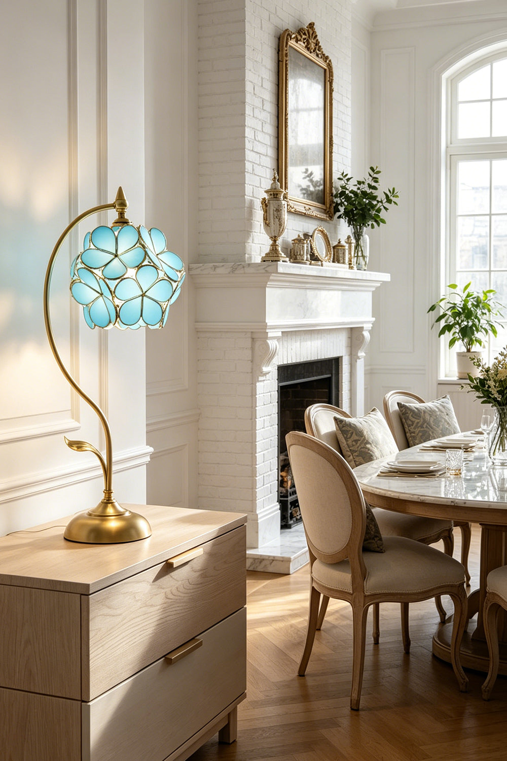 Evanthe Blossom Stained Glass Table Lamp | Stained Glass, Metal | Blue glass flower table light casting a warm inviting glow on a white credenza cabinet in a traditional classical dining room | Samu Lamp