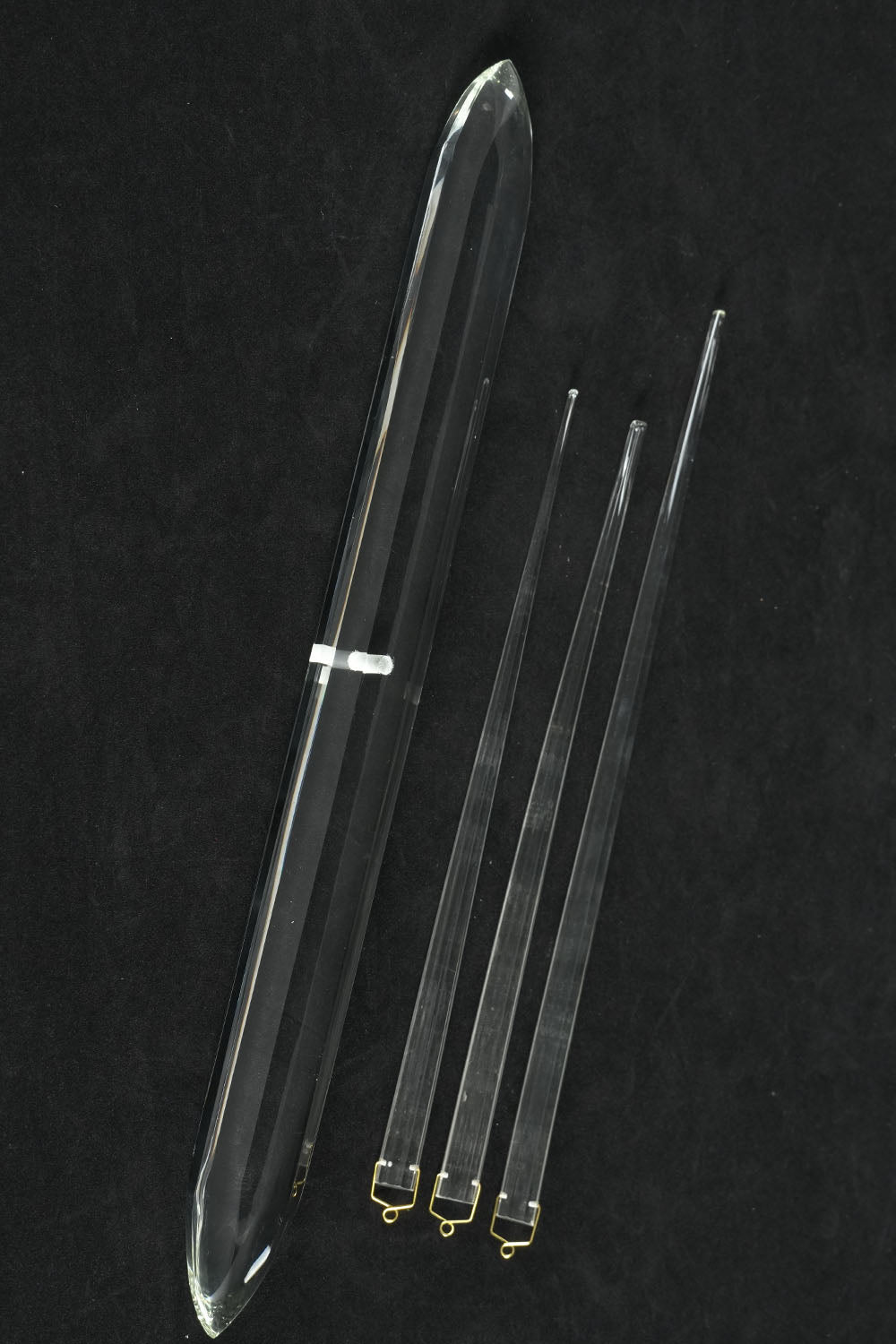 Faucenne Pierced Shade Crystal Spear Wall Lamp | Cut Crystal and Brass | Flat display shot of the clear crystal spear and rods on black backdrop | Samu Lamp