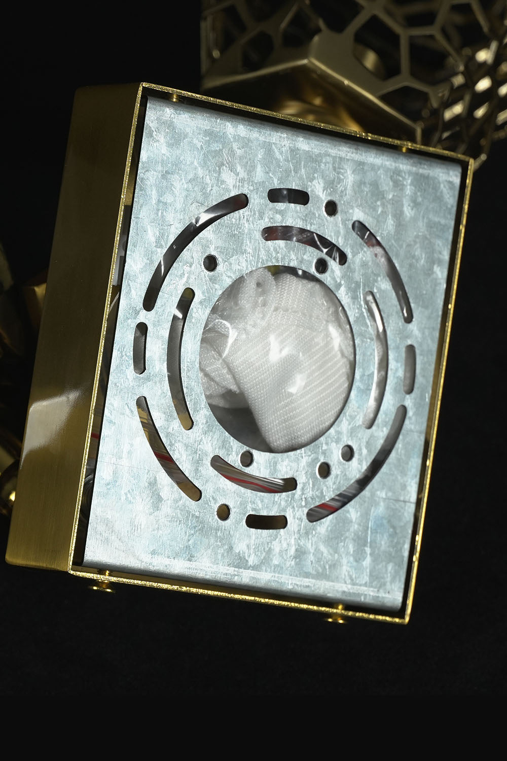 Faucenne Pierced Shade Crystal Spear Wall Lamp | Cut Crystal and Brass | Close-up view of the square brass backplate mounting structure | Samu Lamp