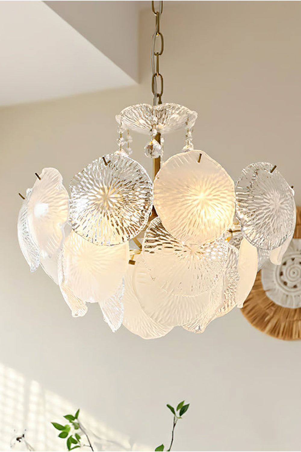 Fiore Radiance Glass Disc Chandelier with cascading glass discs and warm illumination in a modern space.