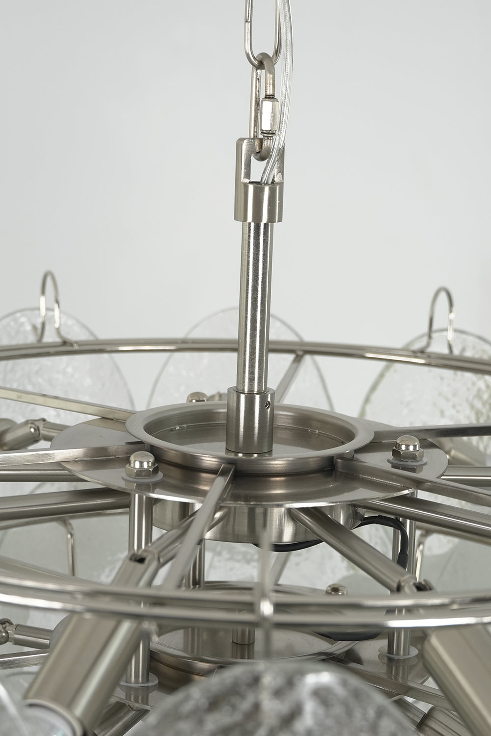 Internal metal frame and ring structure of Frostelle chandelier | Metal | Close-up showing the tiered frame and sockets | Samu Lamp