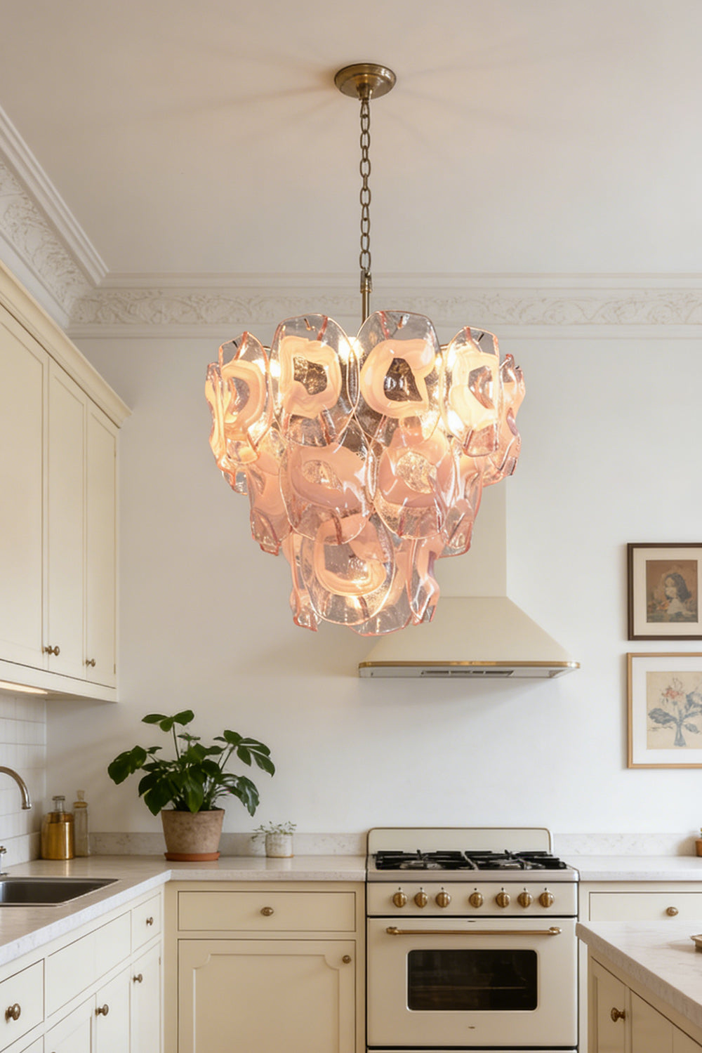 Modern pink glass chandelier | Metal, Glass | Installed in a white kitchen with beige stove | Samu Lamp