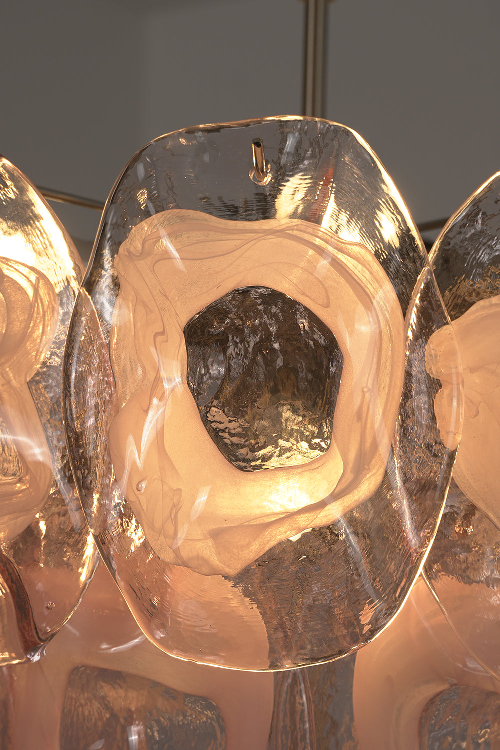 Frostelle pink glass texture | Glass | Close-up view of the glowing glass disc edges | Samu Lamp