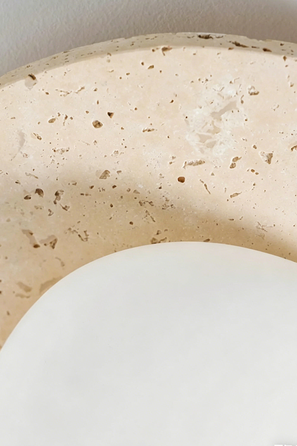 Travertine Ceiling Light Detail | Travertine | Macro shot of porous unlit stone texture | Detailed voids and natural pits | Samu Lamp