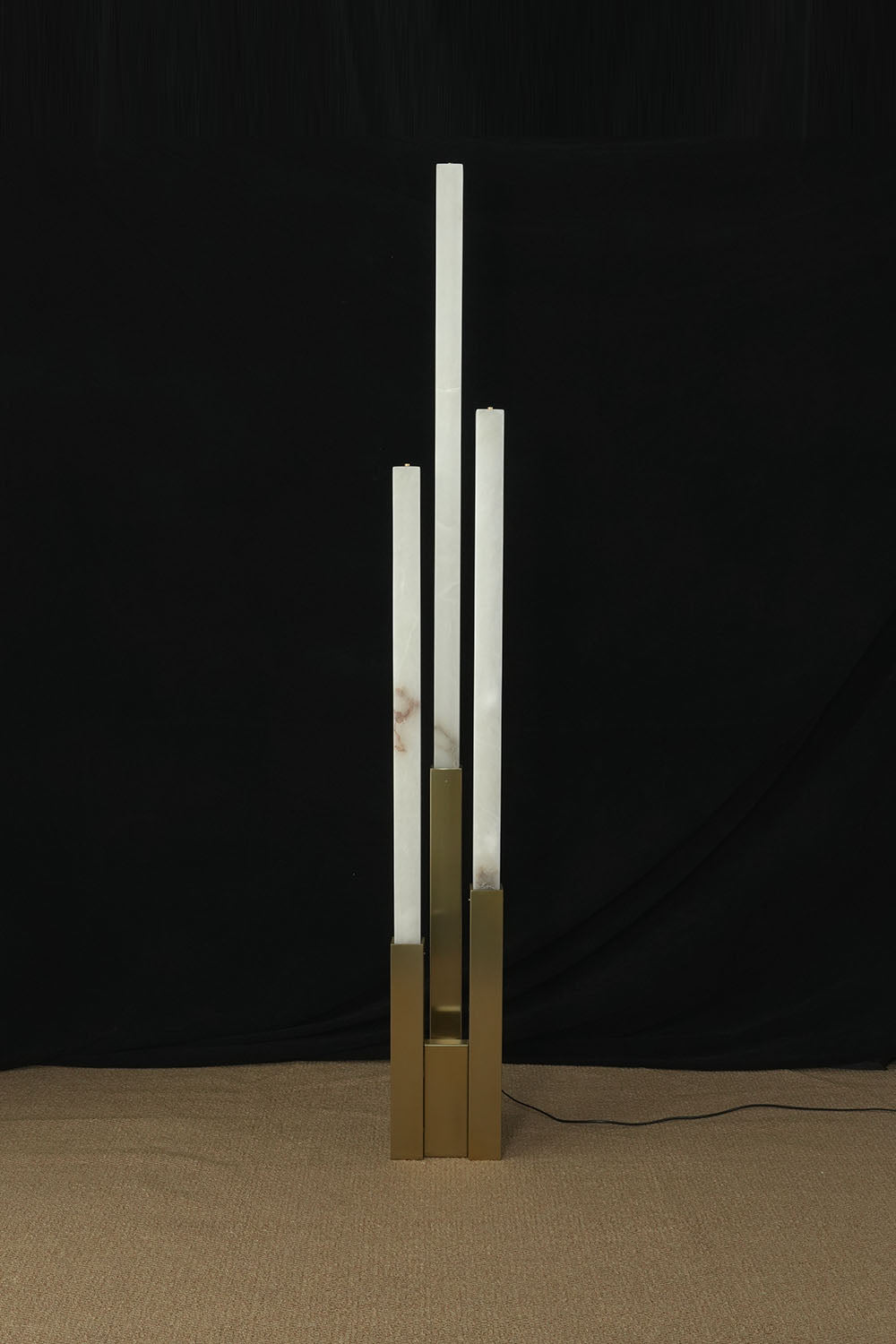 Gethin Triple Column Alabaster Floor Lamp | Natural Alabaster and Brass | Full view unlit product shot displayed on a dark background | Samu Lamp