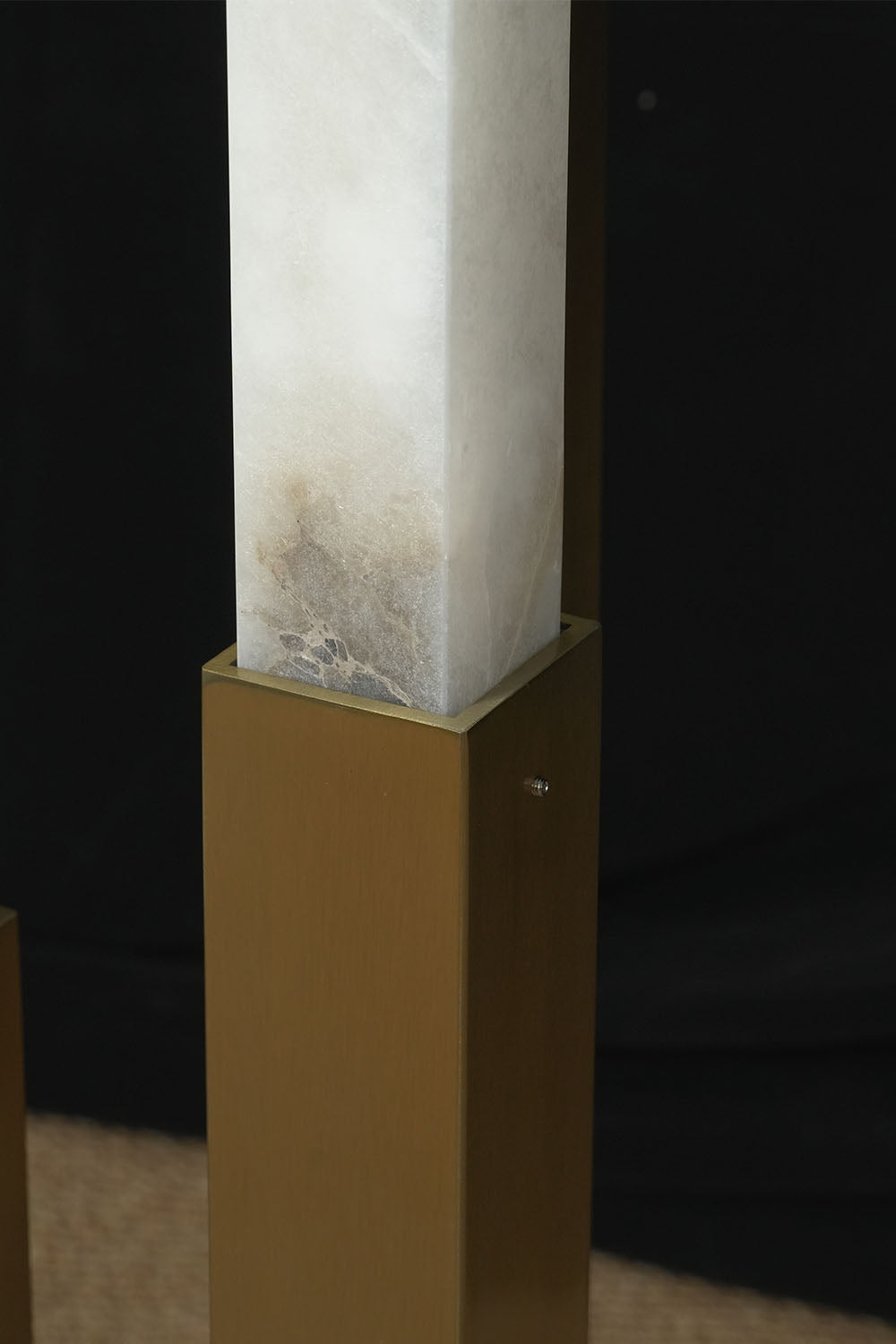 Gethin Triple Column Alabaster Floor Lamp | Natural Alabaster and Brass | Close-up detail showing the brass base joint and alabaster column | Samu Lamp
