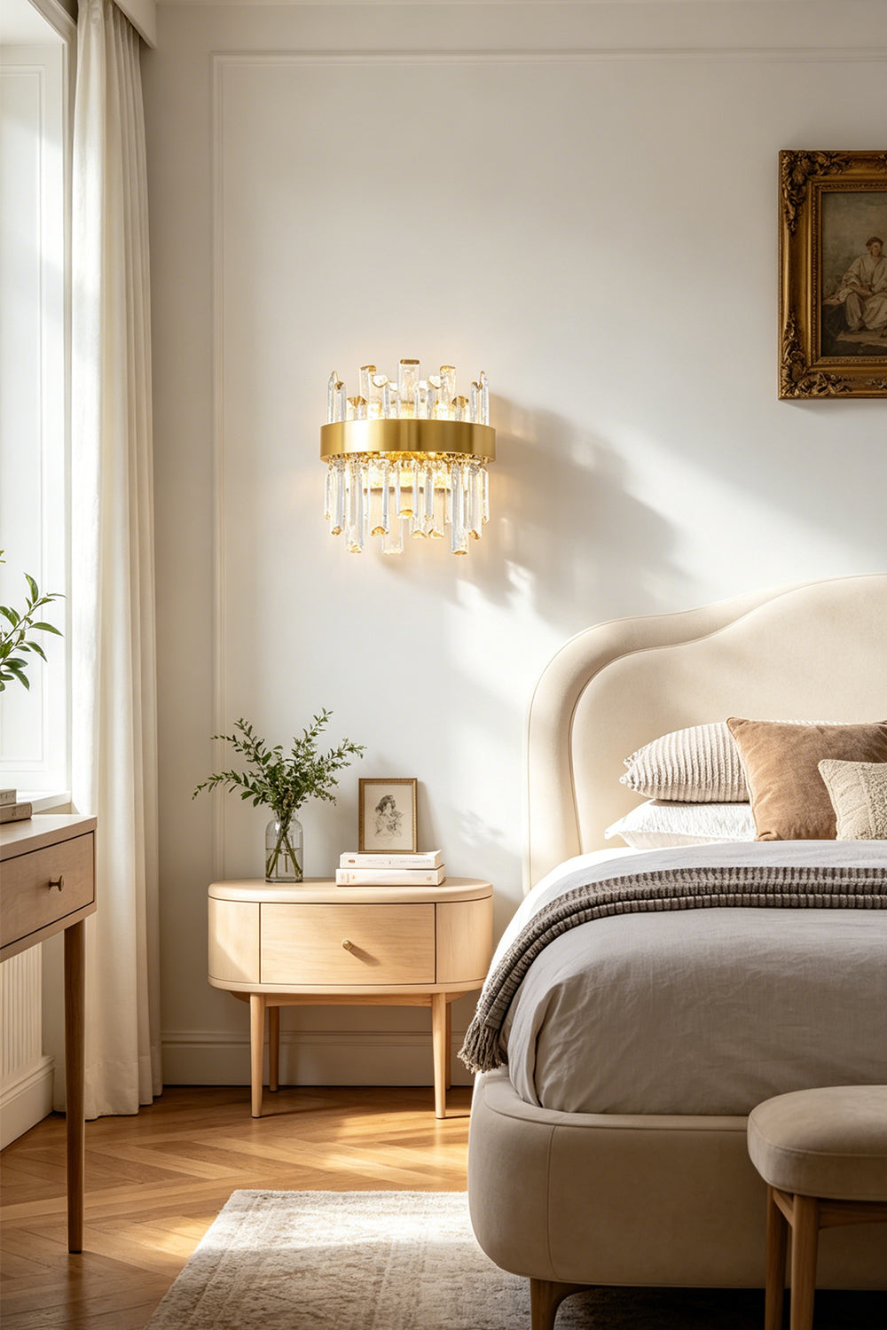 Glacia Tiered Crystal Statement Wall Lamp | Crystal, Metal | Mounted as an elegant bedside reading sconce casting a warm ambient glow above a light wood nightstand in a bright contemporary bedroom | Samu Lamp