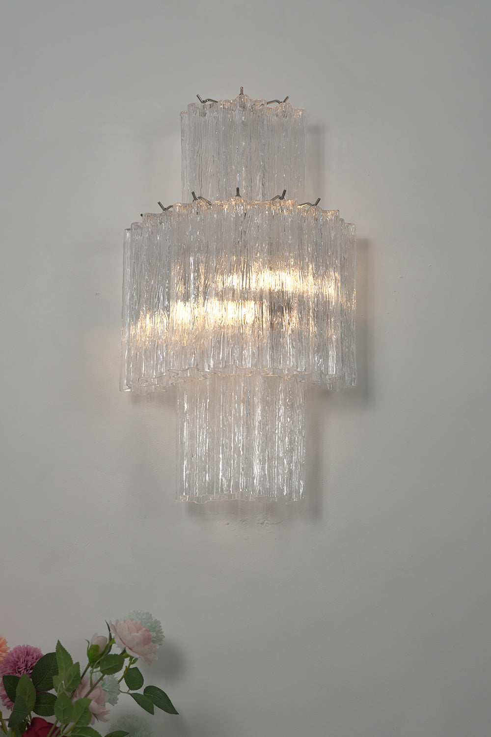 Lit glacier glass wall light | Metal, Glass | Close-up studio shot showing glass layers | Samu Lamp